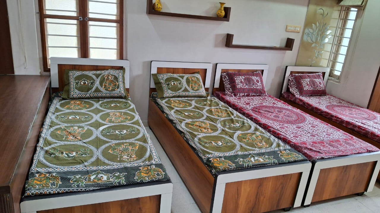Sorath Boys PG 2 comfortable bedroom with beds and study table